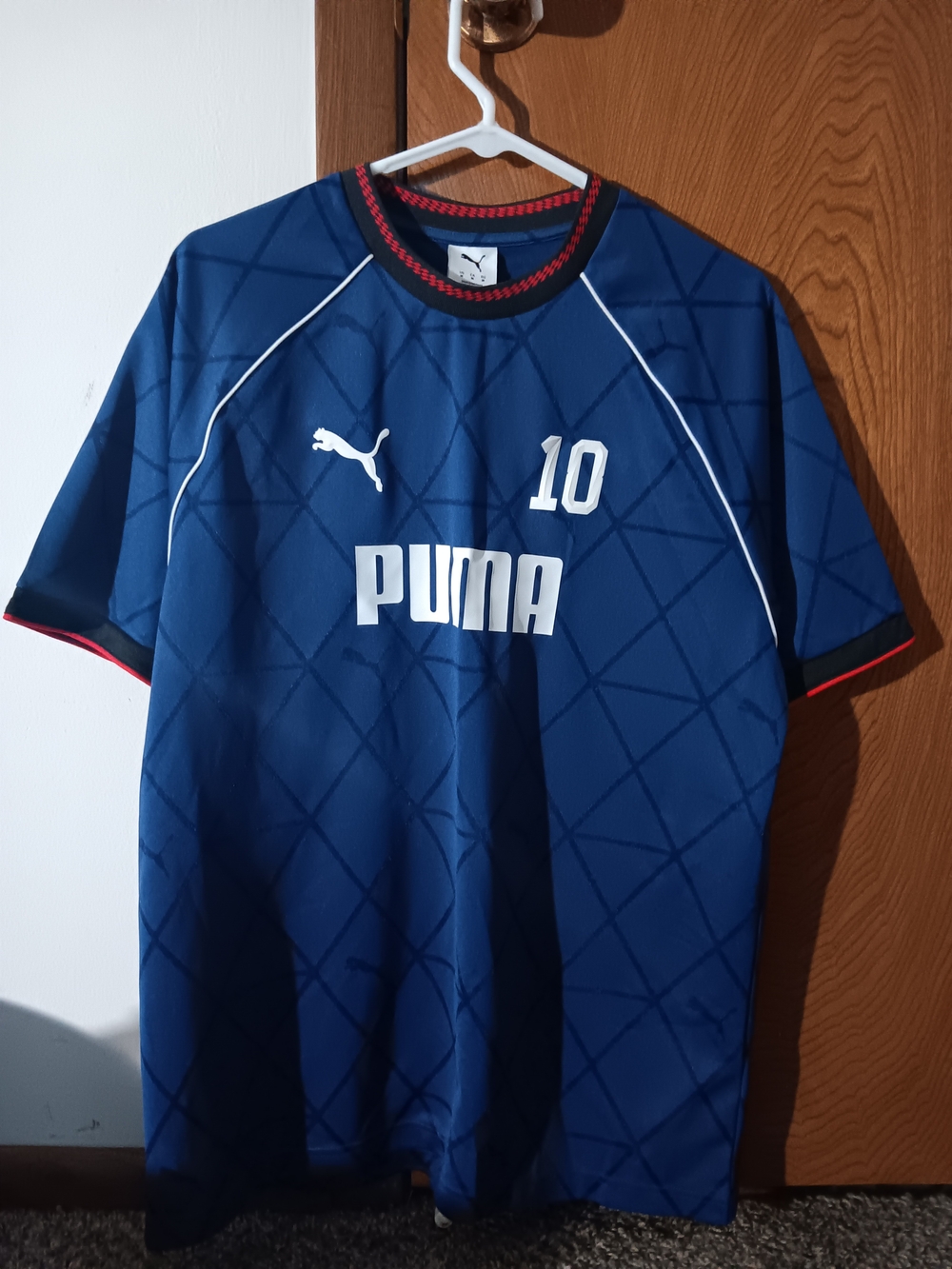 Puma Men's Blue Athletic Jersey with White Logos and Red Trim
